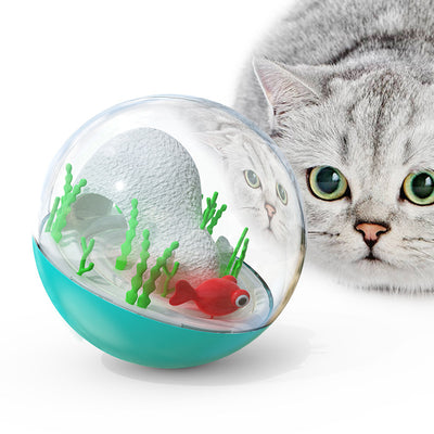 Clear and teal cat toy tumbler with a red fish and green seaweed inside, observed by a curious grey cat. - Image 5