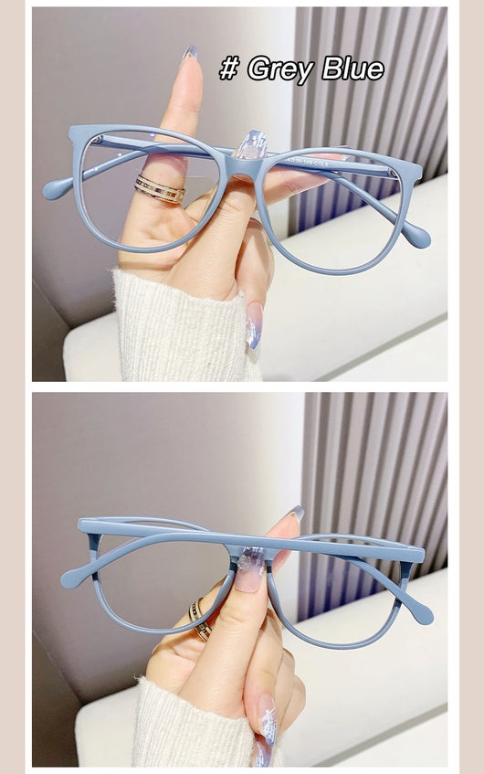 Black full-frame round anti-blue light glasses held by a hand with a gold ring and light blue gradient nails. - Image 25