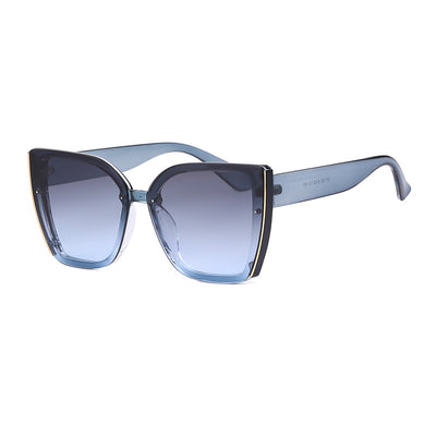 Women's black cat-eye sunglasses with large frames, gradient gray lenses, and gold-tone accents. - Image 4
