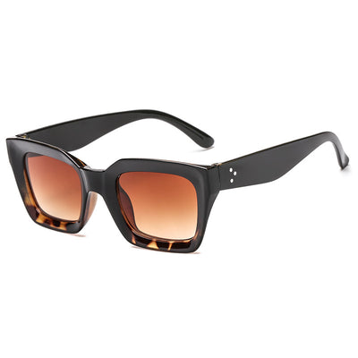 Black vintage-style sunglasses with thick plastic frames and dark rectangular lenses, featuring a subtle cat-eye shape. - Image 7