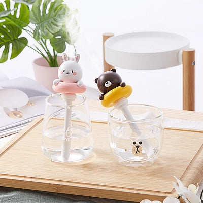 Two white and pink rabbit-shaped mini portable humidifiers, one facing forward and one showing the USB port. - Image 12