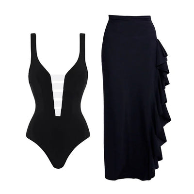 Black one-piece swimsuit with a deep V-neckline and white horizontal stitching detail across the plunge. - Image 19