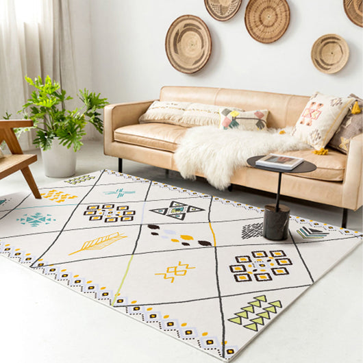 Rectangular area rug with white background and horizontal stripes of black, teal, and yellow tribal patterns. - Image 17