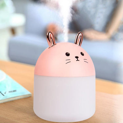 Cute sky blue and white mini USB rabbit humidifier with gold ears, ideal for home or office aromatherapy. - Image 5