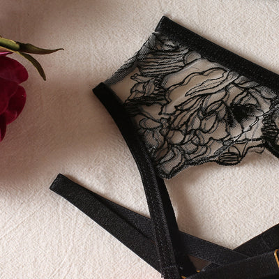 Black lace bra and thong set with hot pink harness straps, gold-tone rings, and a matching hot pink choker. - Image 5