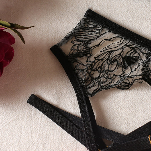 Black lace bra and thong set with hot pink harness straps, gold-tone rings, and a matching hot pink choker. - Image 5