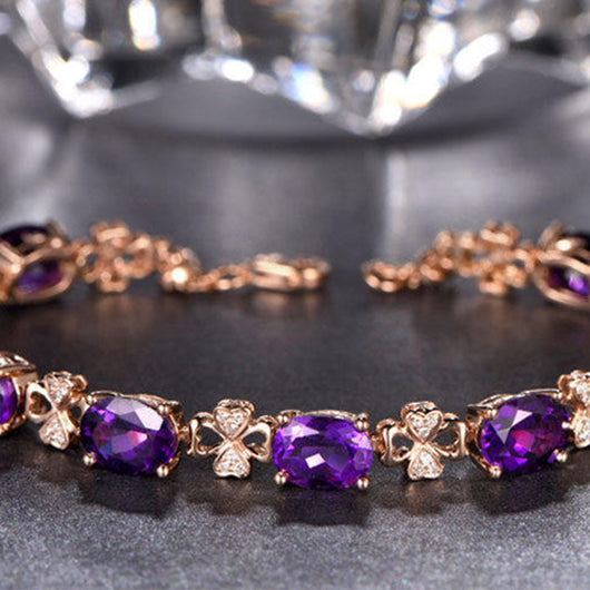 Rose gold necklace with a teardrop purple gemstone pendant and matching dangle earrings. - Image 15