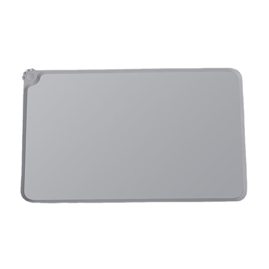 Blue rectangular silicone pet placemat with a raised edge and a small paw print detail in the corner. - Image 3