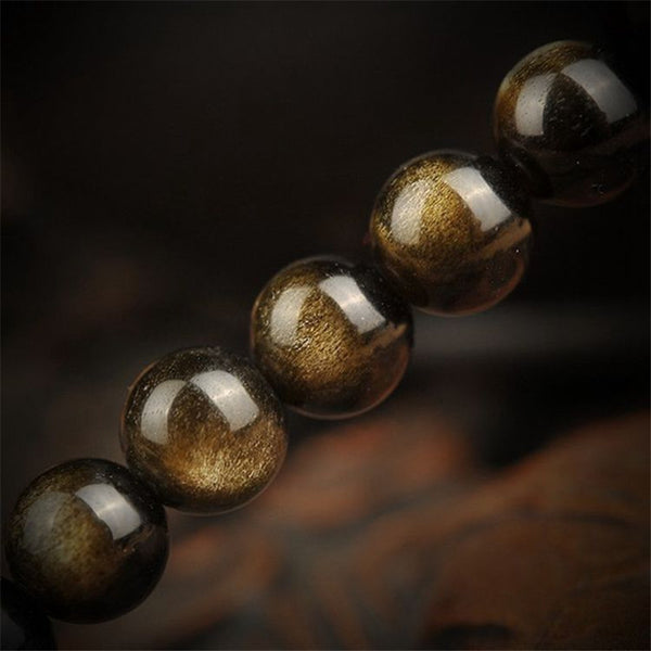 Pulsera de Obsidiana Dorada con 108 Cuentas Buda y Plata Tibetana