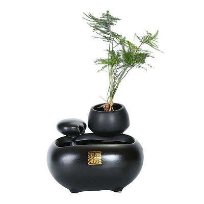 White ceramic flowing water fountain ornament with an integrated planter holding a green plant. Features gold Chinese characters. - Image 3