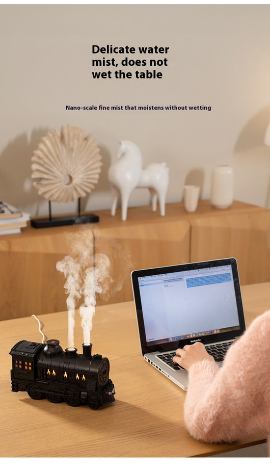 Black train-shaped essential oil diffuser and humidifier with retro design, emitting mist and glowing lights. - Image 9