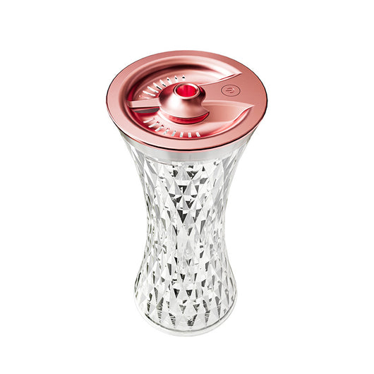 Rose gold and clear crystal-like desktop humidifier with a faceted body and an atmosphere lamp function. - Image 4