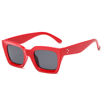 Black vintage-style sunglasses with thick plastic frames and dark rectangular lenses, featuring a subtle cat-eye shape. - Image 10