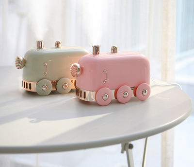 Pink retro mini train ultrasonic humidifier and aroma diffuser with rose gold accents on a white background. - Image 8