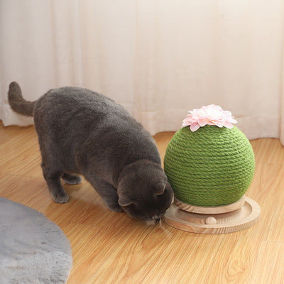 Green rope cat scratching toy shaped like a cactus with a pink flower on top, sitting on a light wood base. - Image 9