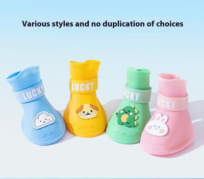 Four yellow silicone dog booties with a cartoon dog face emblem and "LUCKY" strap on a light blue background. - Image 11