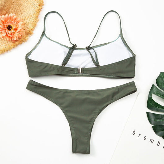 Women's casual orange textured bikini set with scoop neck top and high-cut bottoms against a stone wall. - Image 5