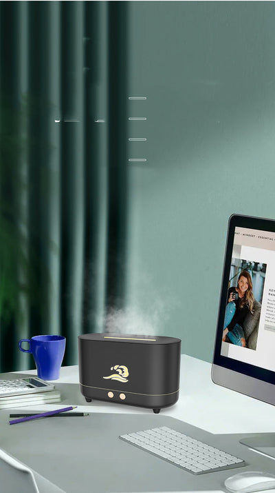 White simulated flame humidifier with a golden wave logo, emitting orange light and mist, on a dark green background. - Image 7