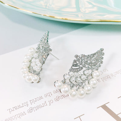 Aretes de Perla Elegantes con Zirconia y Diseño Ondulado - Image 13