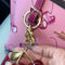 Llavero Encanto Rojo Cereza con Detalles Dorados