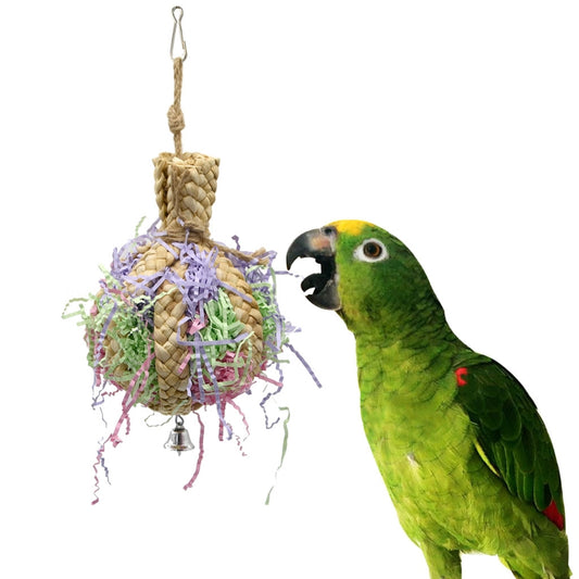 Woven straw paper parrot toy filled with colorful shredded paper, featuring a small bell at the bottom.