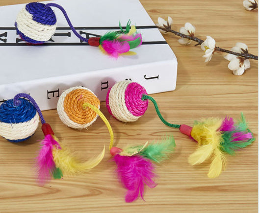 Four sisal ball cat toys with colorful feathers in pink, purple, blue, and teal stripes, for playing and grinding claws. - Image 8