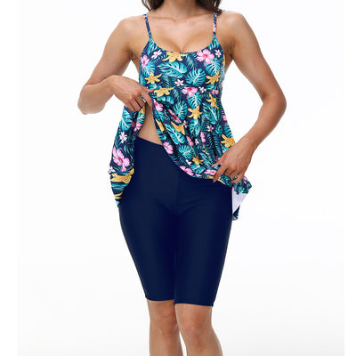 Women's navy blue two-piece swimsuit with white floral tankini top and matching solid swim shorts. - Image 14