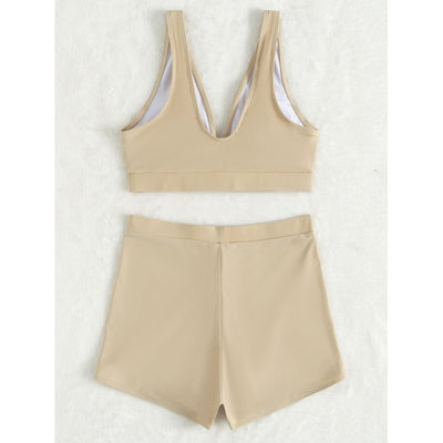Women's deep-V Halong Bay-style two-piece swimsuit in light beige, featuring a crop top and high-waisted shorts. - Image 4