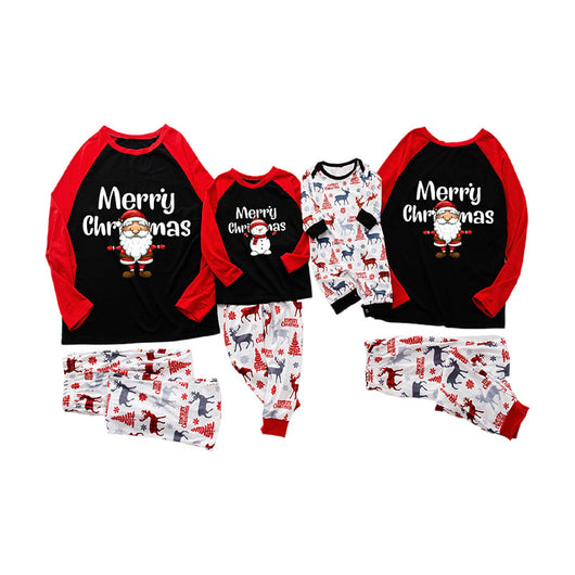 White baby romper with long sleeves, featuring a festive pattern of red and blue reindeer, Christmas trees, and snowflakes.