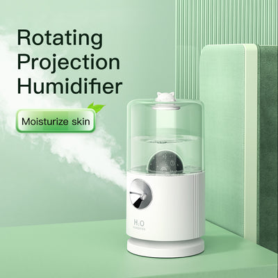 Light blue smart rotary projection humidifier with a clear water tank and a cute cat-shaped top. - Image 11