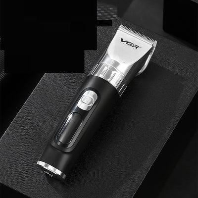 Black hair clipper with LCD digital display showing power and RPM, four guide combs (3mm-12mm), USB cable, cleaning brush, and oil bottle.