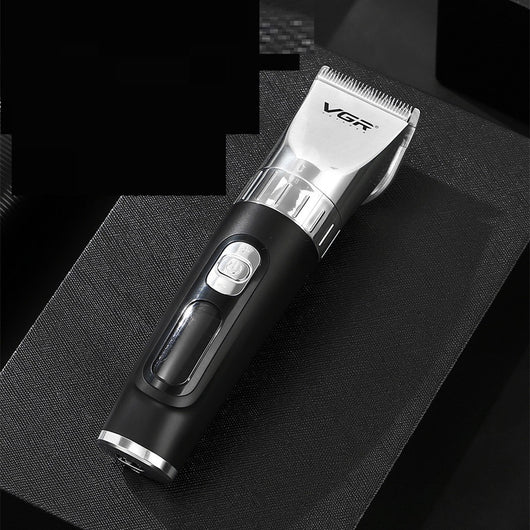 Black hair clipper with LCD digital display showing power and RPM, four guide combs (3mm-12mm), USB cable, cleaning brush, and oil bottle.