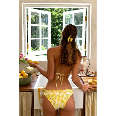 Women's yellow and white gingham bikini with lemon print, ruffled edges, and red bows. Features a triangle halter top and classic brief bottom. - Image 16