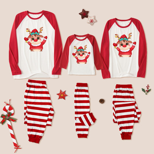 Family matching Christmas pajamas with red raglan sleeve tops featuring a cartoon reindeer and red and white striped pants. - Image 3