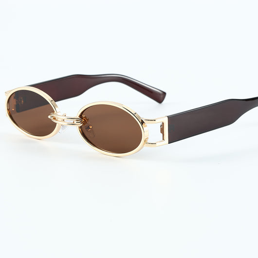 Retro small frame sunglasses with gold round frames and leopard print temples, held by a hand. - Image 20