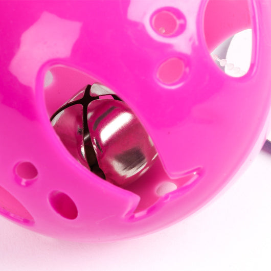 Colorful hollow plastic cat toy ball with purple, lime green, and blue sections, featuring a red bell inside. - Image 2