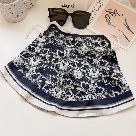Female cream and black floral polka dot sun protection mask with ear loops, designed for eye corner protection. - Image 24