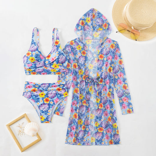 Woman in a red multicolor floral print three-piece swimsuit with high-waisted bikini and long-sleeve cover-up, straw hat, and sunglasses on a beach. - Image 20