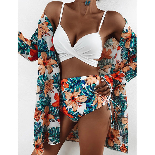 White criss-cross bikini top with high-waisted tropical floral print bottoms and matching long-sleeved cover-up. - Image 22
