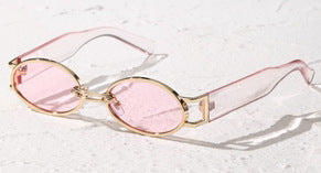 Retro small frame sunglasses with gold round frames and leopard print temples, held by a hand. - Image 4
