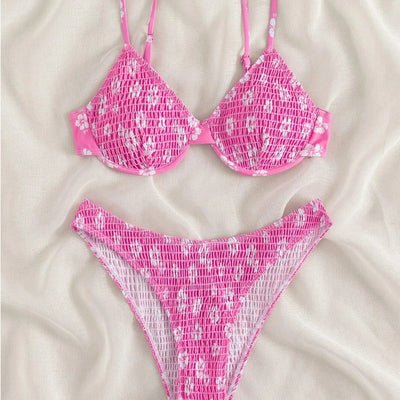 Periwinkle blue two-piece swimsuit with white floral pattern and ruched texture, featuring an underwire bikini top and high-cut bottoms. - Image 3