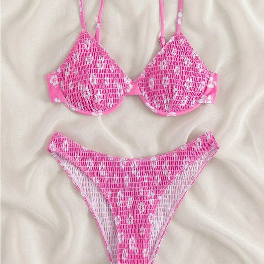 Periwinkle blue two-piece swimsuit with white floral pattern and ruched texture, featuring an underwire bikini top and high-cut bottoms. - Image 3