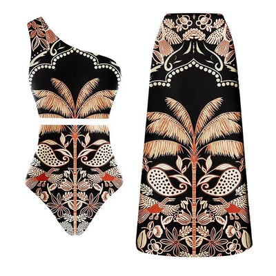 Black one-piece swimsuit with an asymmetrical top and matching long skirt, featuring a tropical palm tree and bird print. - Image 6