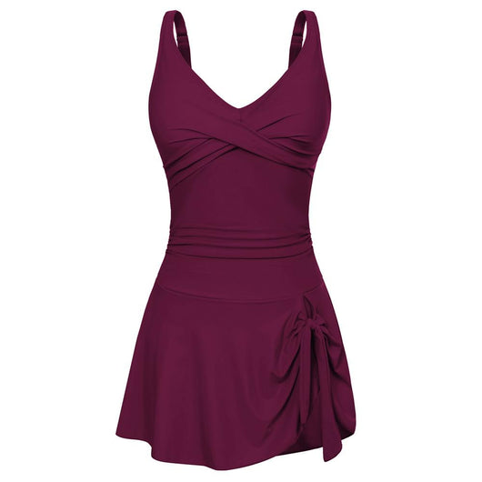 Hot pink one-piece swimdress for women featuring a ruched v-neck bodice and a skirted bottom with a side tie detail. - Image 9