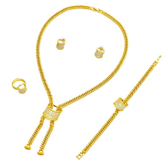 Gold-plated four-piece jewelry set with teardrop rhinestone necklace, bracelet, earrings, and ring on red velvet stands. - Image 5