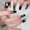 Uñas Postizas con Moño Negro - Diseño Elegante a Mano