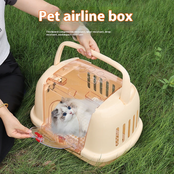 Brown pet carrier with a clear front door, top handle, ventilation slots, and a white urinating pad.