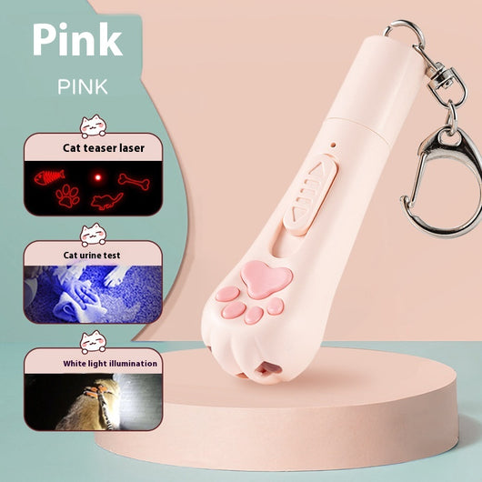 Pink cat paw pen light toy with red laser, UV light for urine detection, and white LED illumination, featuring a keychain.