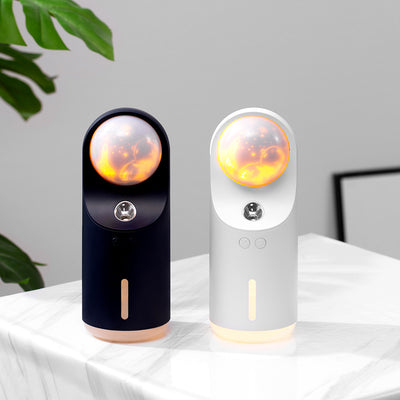 White and dark gray mini wireless ultrasonic humidifier and essential oil diffuser with an illuminated LED night lamp. - Image 4