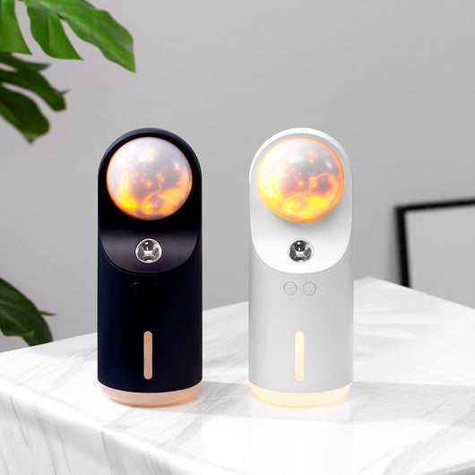 White and dark gray mini wireless ultrasonic humidifier and essential oil diffuser with an illuminated LED night lamp. - Image 4